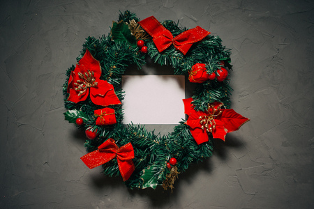 Christmas wreath on a dark textured backgroundの写真素材