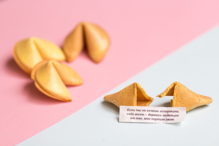 fortune cookie on pink and blue background, pastel colorsの写真素材