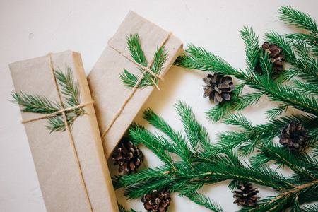 Christmas background with fir tree and decor, gift boxes. Top view with copy space, white backgroundの写真素材