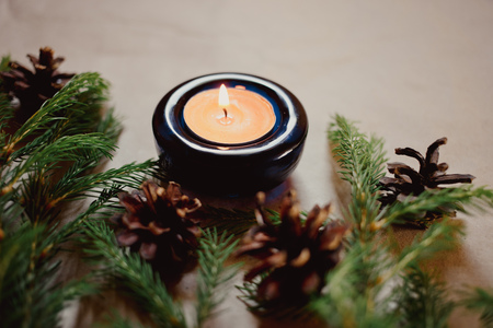 Close up Christmas background with fir tree and decor, candle, Top view with copy spaceの写真素材