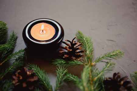 Close up Christmas background with fir tree and decor, candle, Top view with copy space, gray backgroundの写真素材