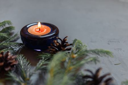 Close up Christmas background with fir tree and decor, candle, Top view with copy space, gray backgroundの写真素材