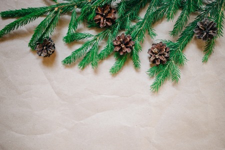 Christmas background with fir tree and cones. Top view with copy space, Kraft paperの写真素材
