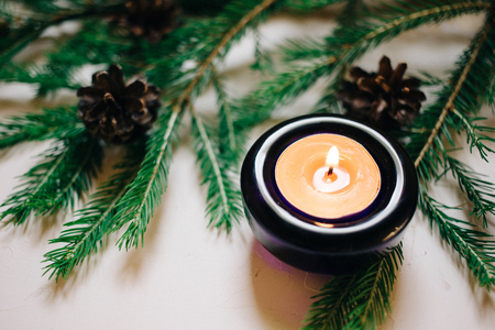 Close up Christmas background with fir tree and decor, candle, Top view with copy space, white backgroundの写真素材