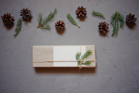 Christmas background with fir tree and decor, gift boxes. Top view with copy space, gray plastered backgroundの写真素材