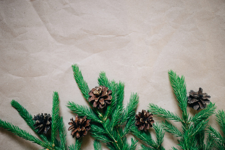 Christmas background with fir tree and cones. Top view with copy space, Kraft paperの写真素材