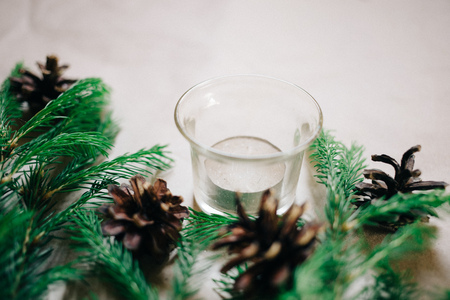Close up Christmas background with fir tree and decor, candle, Top view with copy spaceの写真素材