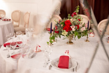 table decor for wedding ceremony, table setting, flowers, red and white decorの写真素材