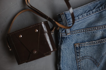 Moscow, Russia - 08 30 2018:top view blue jeans, vintage retro camera, copy spaceの写真素材