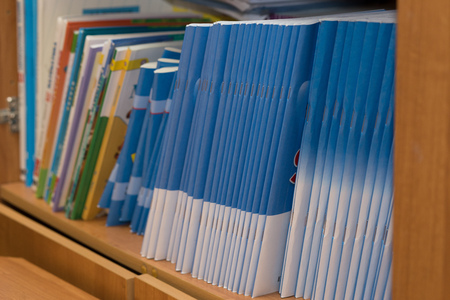 colored magazines on the shelf, educational book