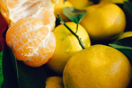 tangerines with green leaves background, fresh fruitsの写真素材
