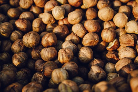 Hazelnut Background. Top view heap of peeled hazelnuts.の写真素材