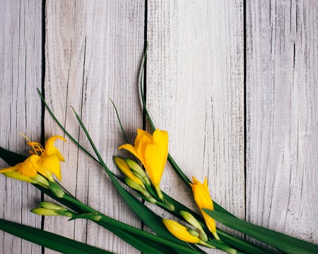 bouquet of yellow lilies on a wooden background, wedding bouquetの写真素材