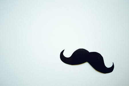 Paper Mustache on light blue background, Prostate cancer awareness , Men health awareness month, copy spaceの写真素材