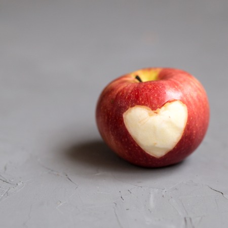Red Apple with engraved heartの写真素材