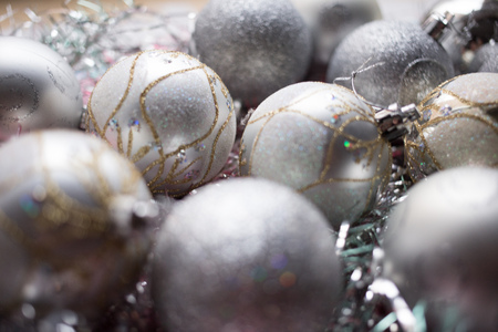 Christmas composition. Christmas silver balls decorations on white tinsel background.の写真素材