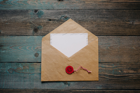greetin card in an envelope, Christmas, New Year dark wooden flat lay with Winter wooden decor composition. Copy spaceの写真素材
