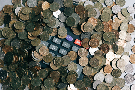 Russian money, coins and banknotes, calculator on the grey background, finance business concept