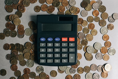 Russian money, coins and banknotes, calculator on the grey background, finance business conceptの写真素材