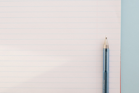 Ball pen and office pad, clear notebook, close up, copy space
