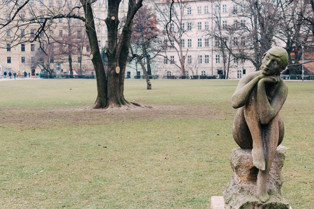 Prague, Czech Republic - 04 02 2013: Architecture, buildings and landmark. sculpture of a girl sitting on the stoneの写真素材