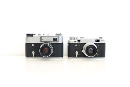 Two vintage soviet film photocameras on white backgroundの写真素材