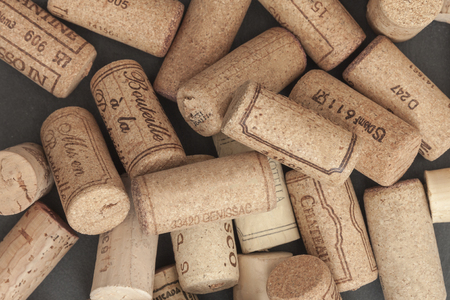 Many different wine corks on a stone plateの写真素材