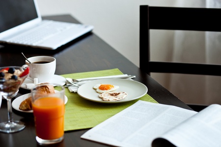 heart shaped sunny side up eggs with delicious breakfastの写真素材
