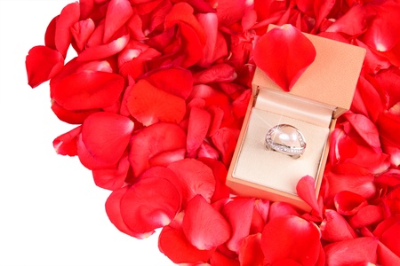 Ring with pearl in a gift box with roses petals for Valentines Day or Engagement
