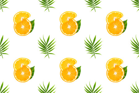 Fresh orange fruit slices with green palm leaf on white background. Seamless pattern with fruits,...