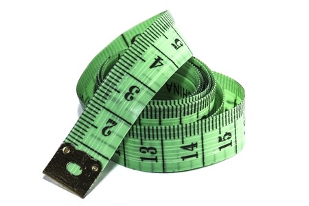 Measuring tape of the tailor , on white background