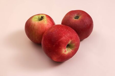 Fresh Harvested red apple lies on trend pink background. Fruit with vitamin C, Keratin. Natural Organic Top View Flat Lay. Rustic Style. Country Village Agriculture conceptの写真素材