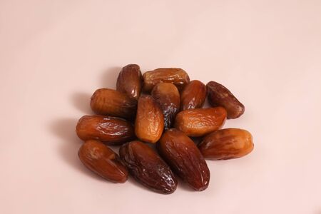 Heap of pitted dates isolated on backgroundの写真素材