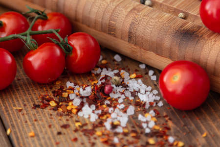spices onion red pepper garlic on wood boardの写真素材
