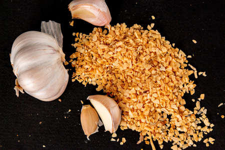 dried garlic garlic on black backgroundの写真素材