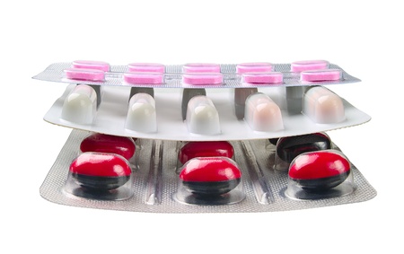 Medications in tablets and capsules isolated on a white background   