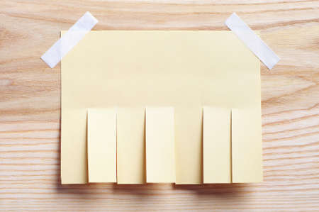 Paper for announcement on a wooden backgroundの写真素材