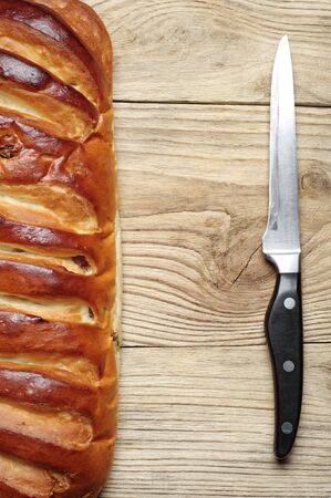 Background with white bread and knife