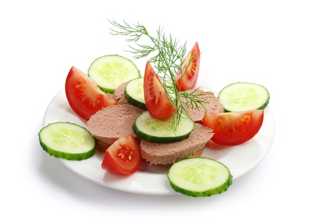 Sandwich with liverwurst, fresh cucumber and tomato on whiteの写真素材