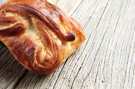 Fresh bun on wooden table closeupの写真素材