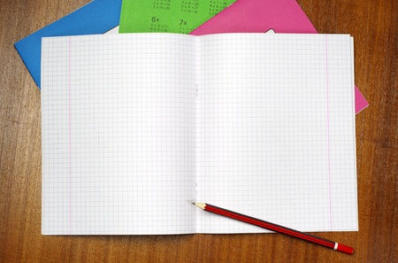 Opened school notebook and pencil on tableの写真素材