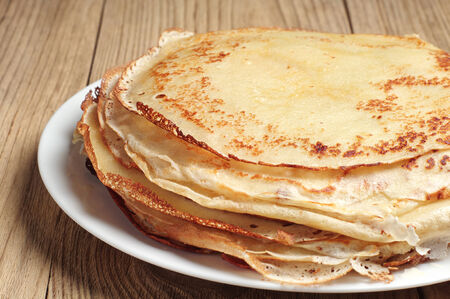 Stack of pancakes on wooden table closeupの写真素材