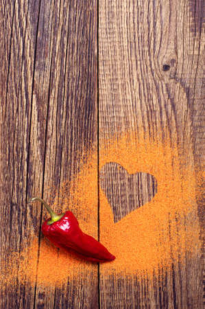 Red hot peppers on old wooden table with place for text. Top viewの写真素材