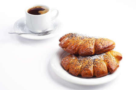 Two sweet buns and cup of hot coffee on white backgroundの写真素材