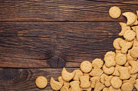 Christmas decorative cookies on dark wooden background, top viewの写真素材