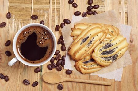 Coffee cup and cookies for breakfast on old wooden table, top viewの写真素材