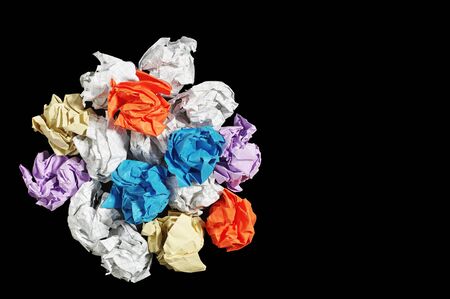 Colorful crumpled paper balls on black background. Conceptual photoの写真素材
