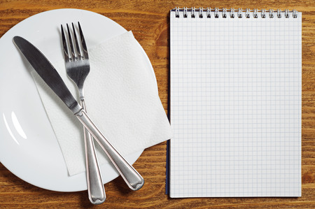 Notepad and cutlery. You can use as a template for a menu of cafes and restaurants