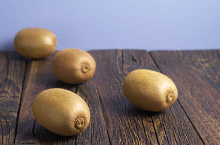 Ripe kiwi fruit on old wooden table. Selective focusの写真素材