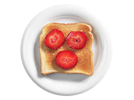 Toast with strawberries in plate isolated on white background, top viewの写真素材